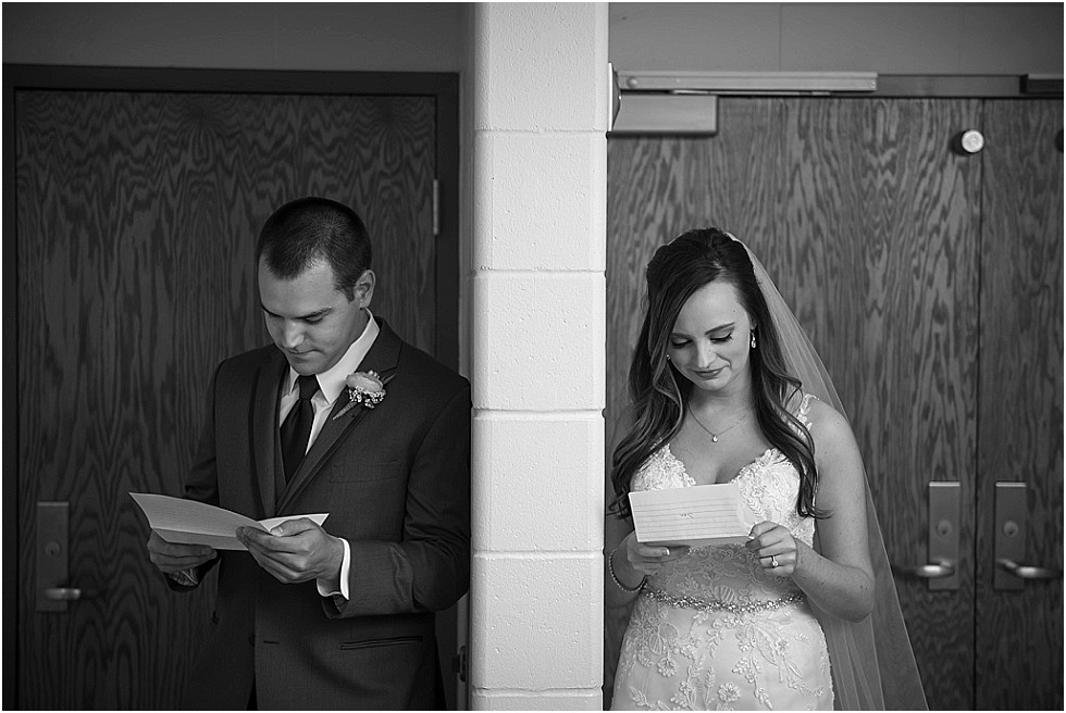 bride and groom reading each others notes before first look