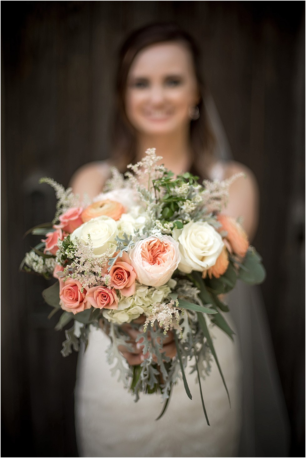 bride showing off her bouquet