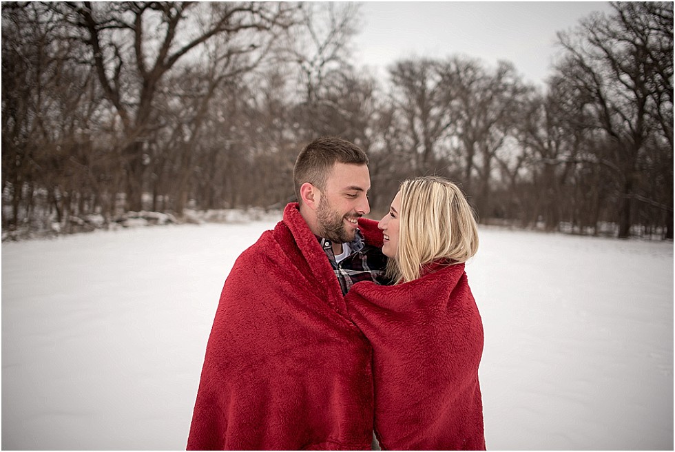 bride and groom wrapped in blanket Lincoln Nebraska engagement photographer