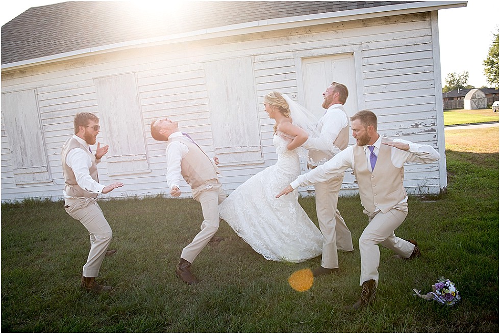 groom and brothers doing kung fu moves