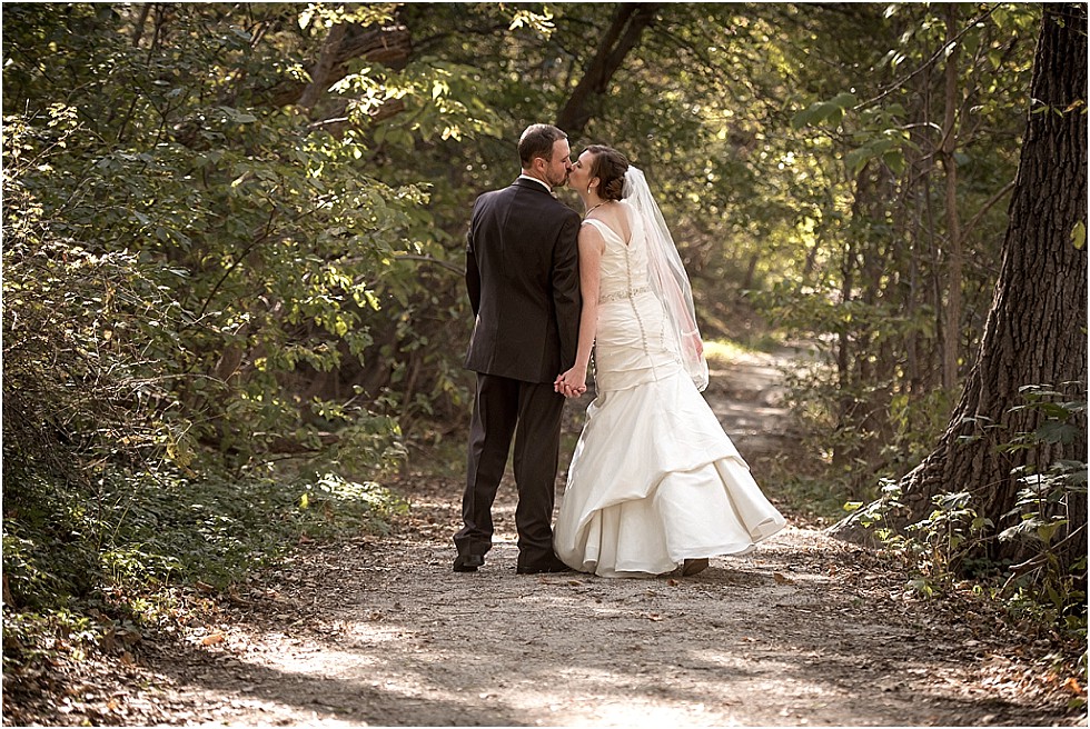 bride and groom kissing in Elmwood Park Omaha Nebraska