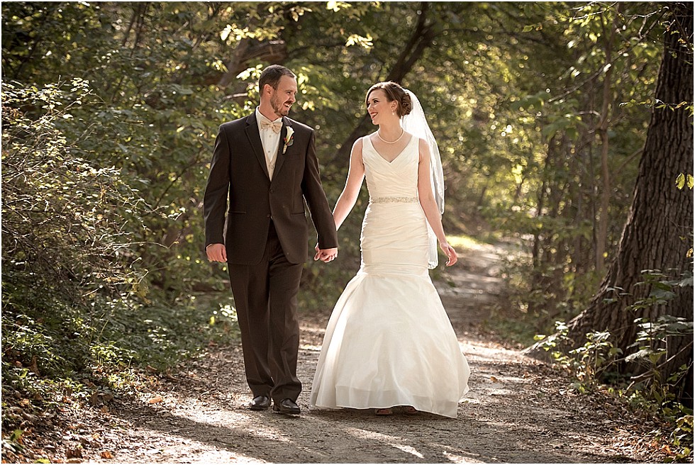 bride and groom walking holding hands in Elmwood Park Omaha Nebraska