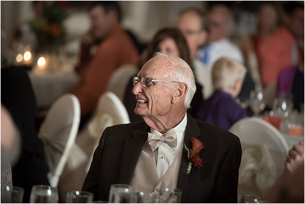 grandfather smiling during toasts