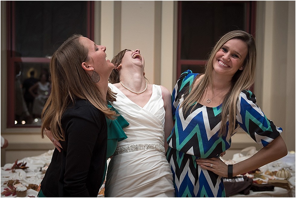 bride laughing with friends at Livestock Exchange Ballroom