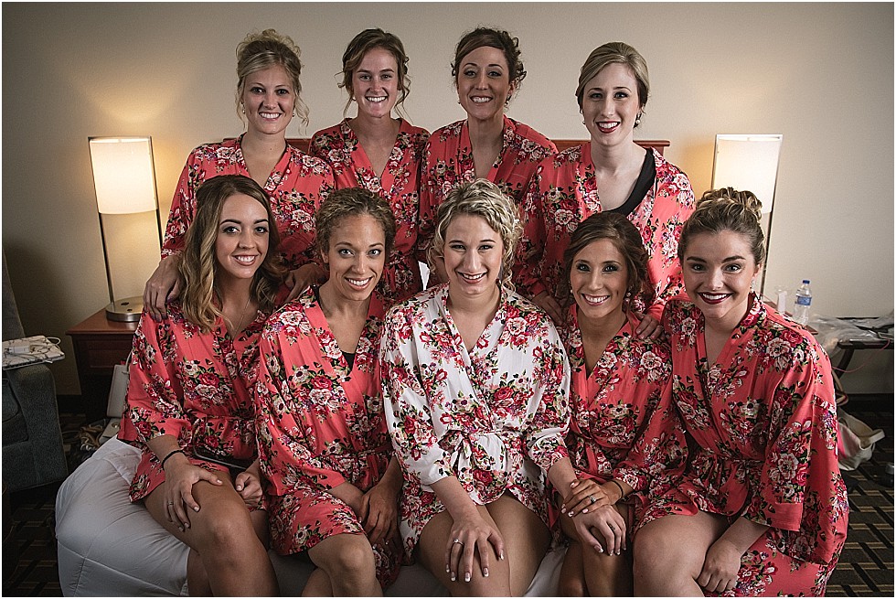 bridesmaids on bed in robes