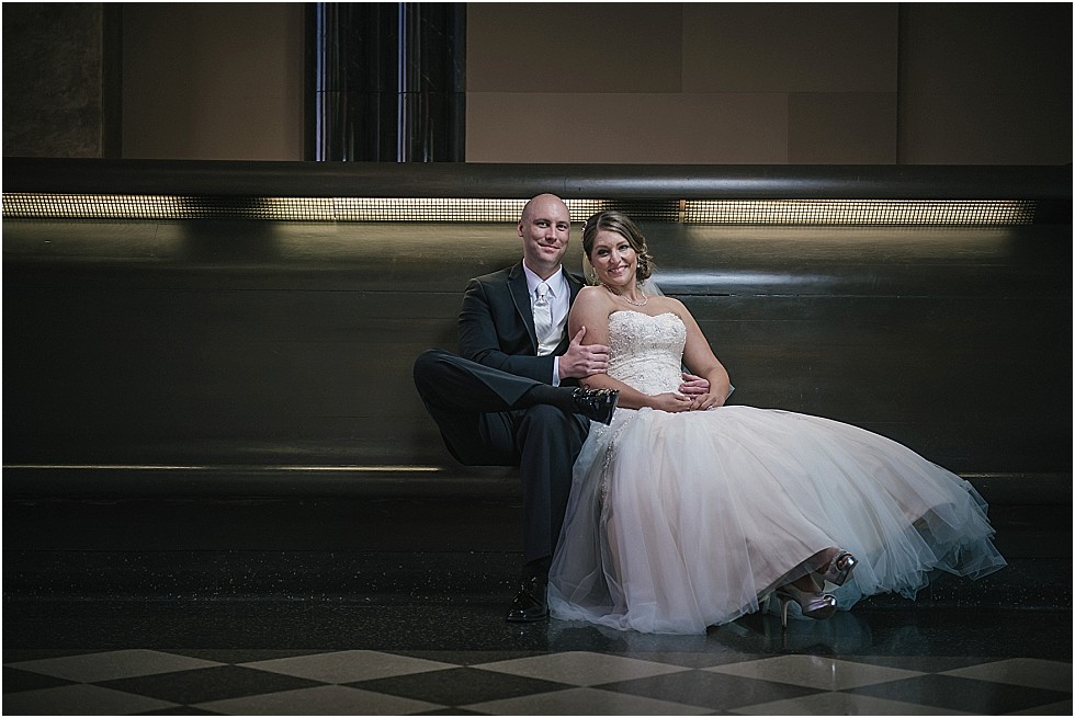 bride and groom sitting at Durham Museum