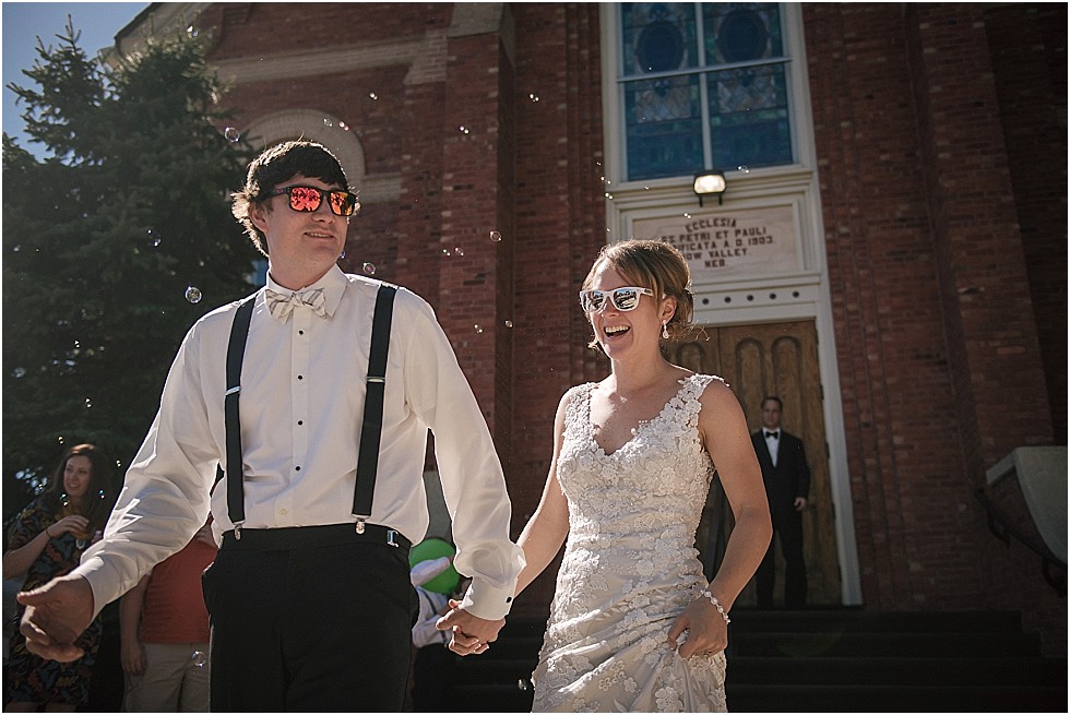 bride and groom smiling after exiting church
