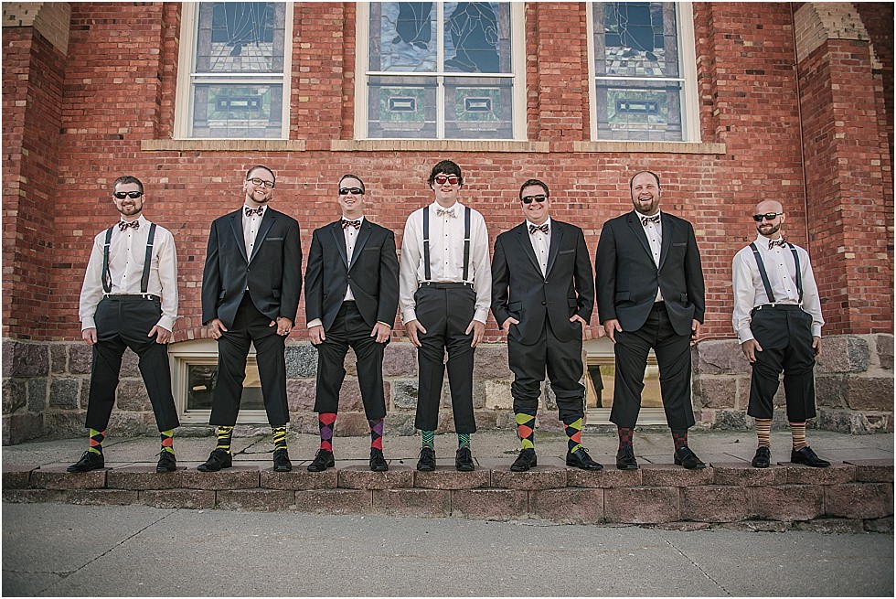 groomsmen showing off their socks
