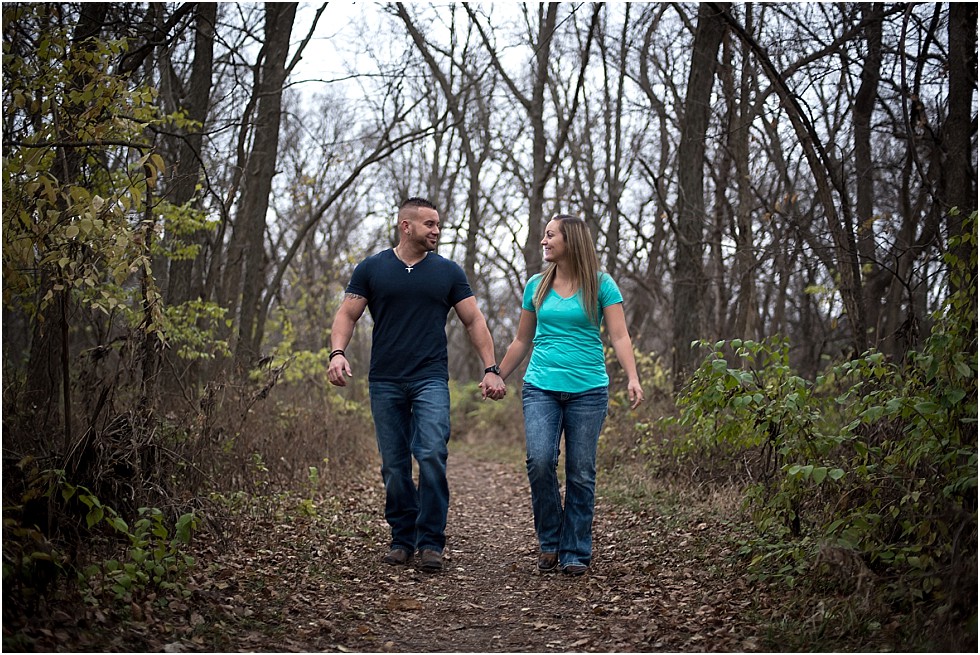couple walking holding hands at Wilderness Park Lincoln Nebraska
