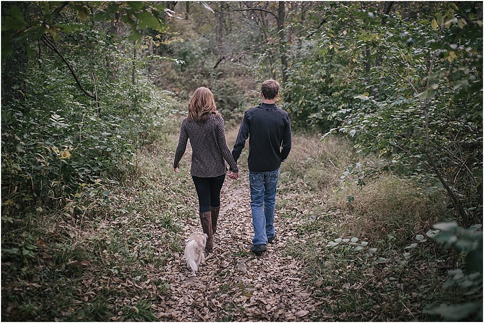couple walking down path with dog Wilderness Park