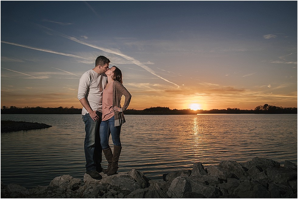 couple kissing by Yankee Hill Lake at Sunset