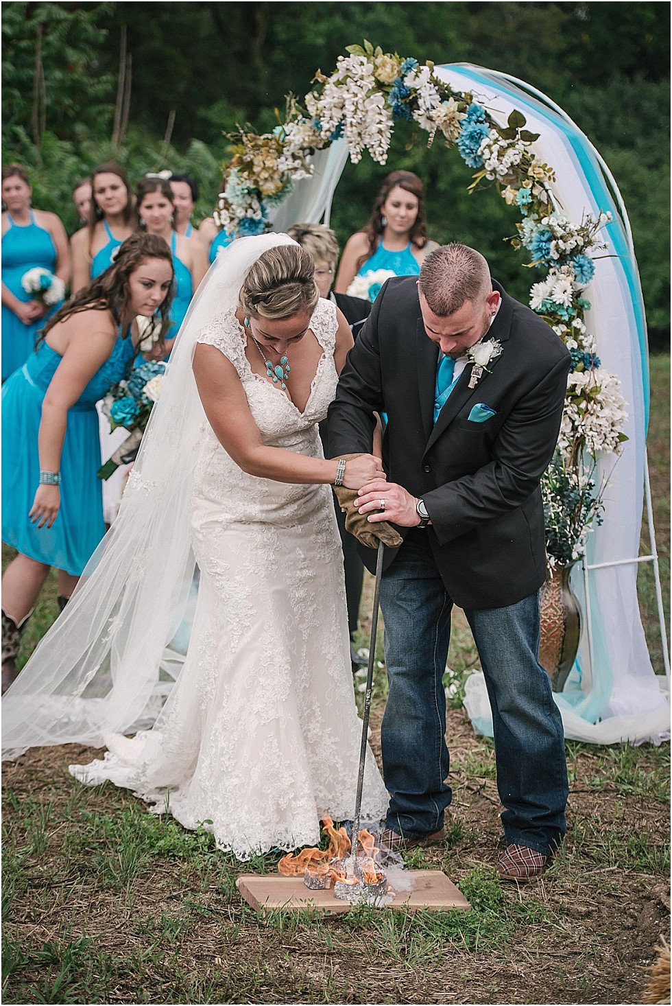 bride and groom branding a piece of walnut