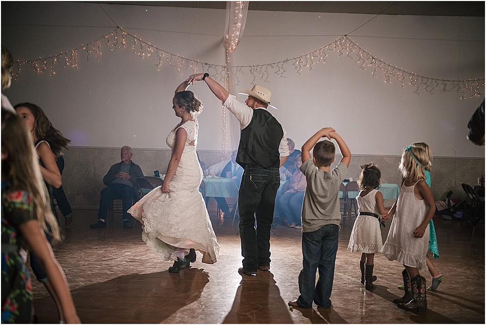 groom spinning bride on dance floor