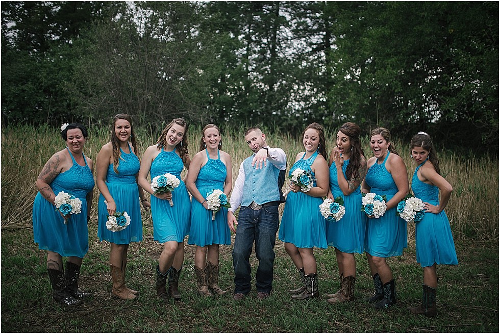 groom showing off his wedding ring to bridesmaids