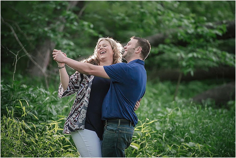 couple having fun dancing at engagement session