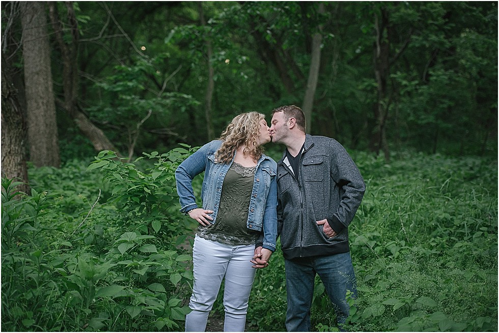 couple kissing on engagement shoot