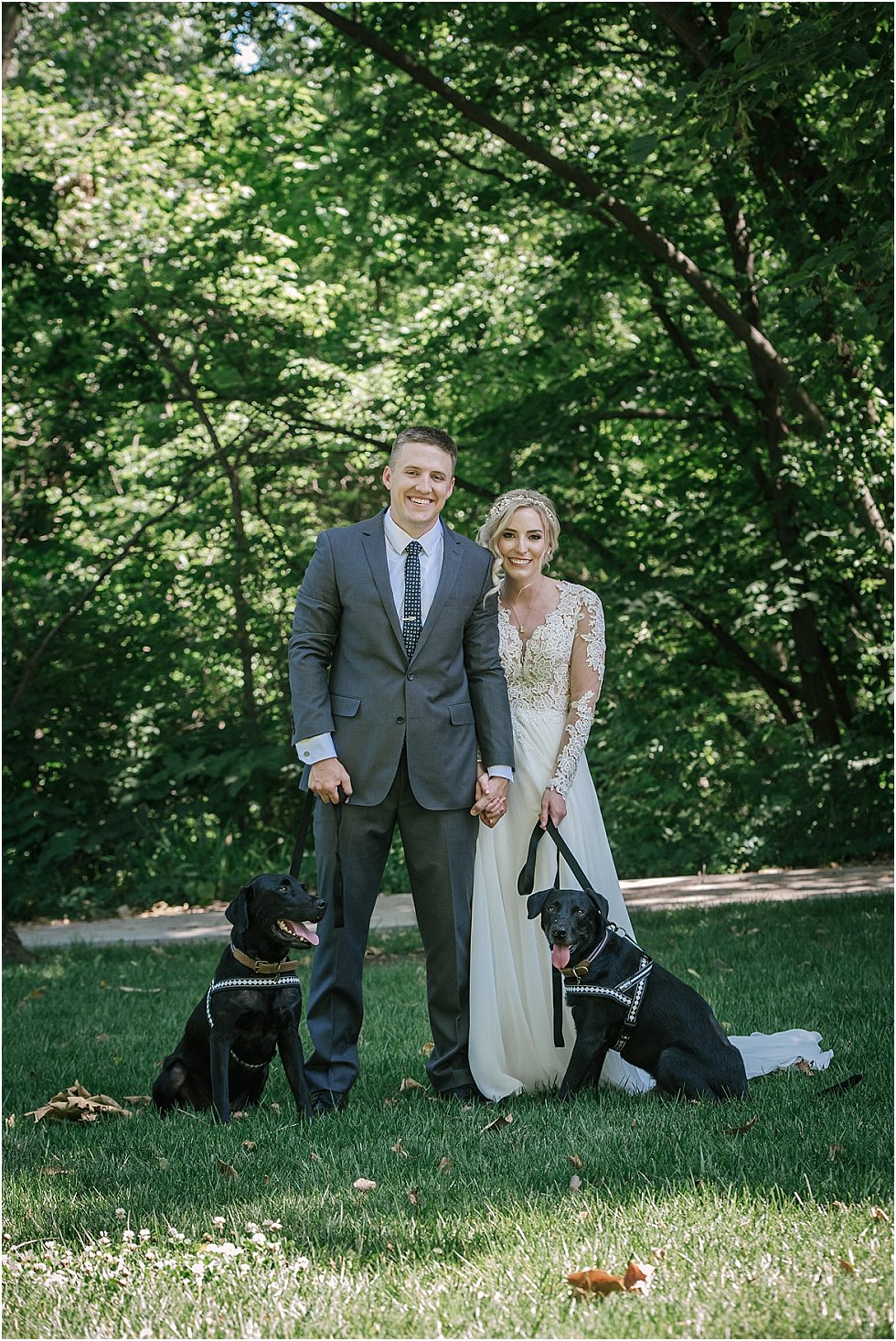 couple with their dogs