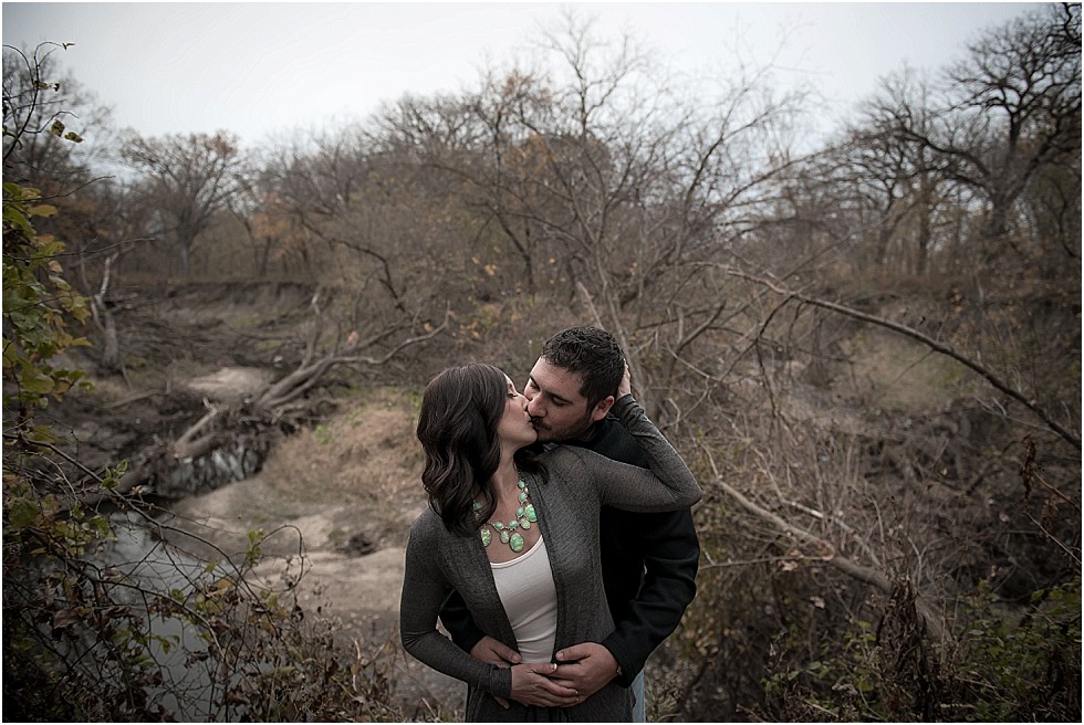 couple posing by creek lincoln nebraska engagement session
